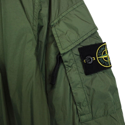 Stone Island green nylon overshirt jacket with full zip and compass logo patch.