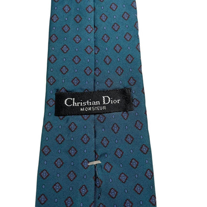 Christian Dior blue silk tie with subtle sheen and classic design.