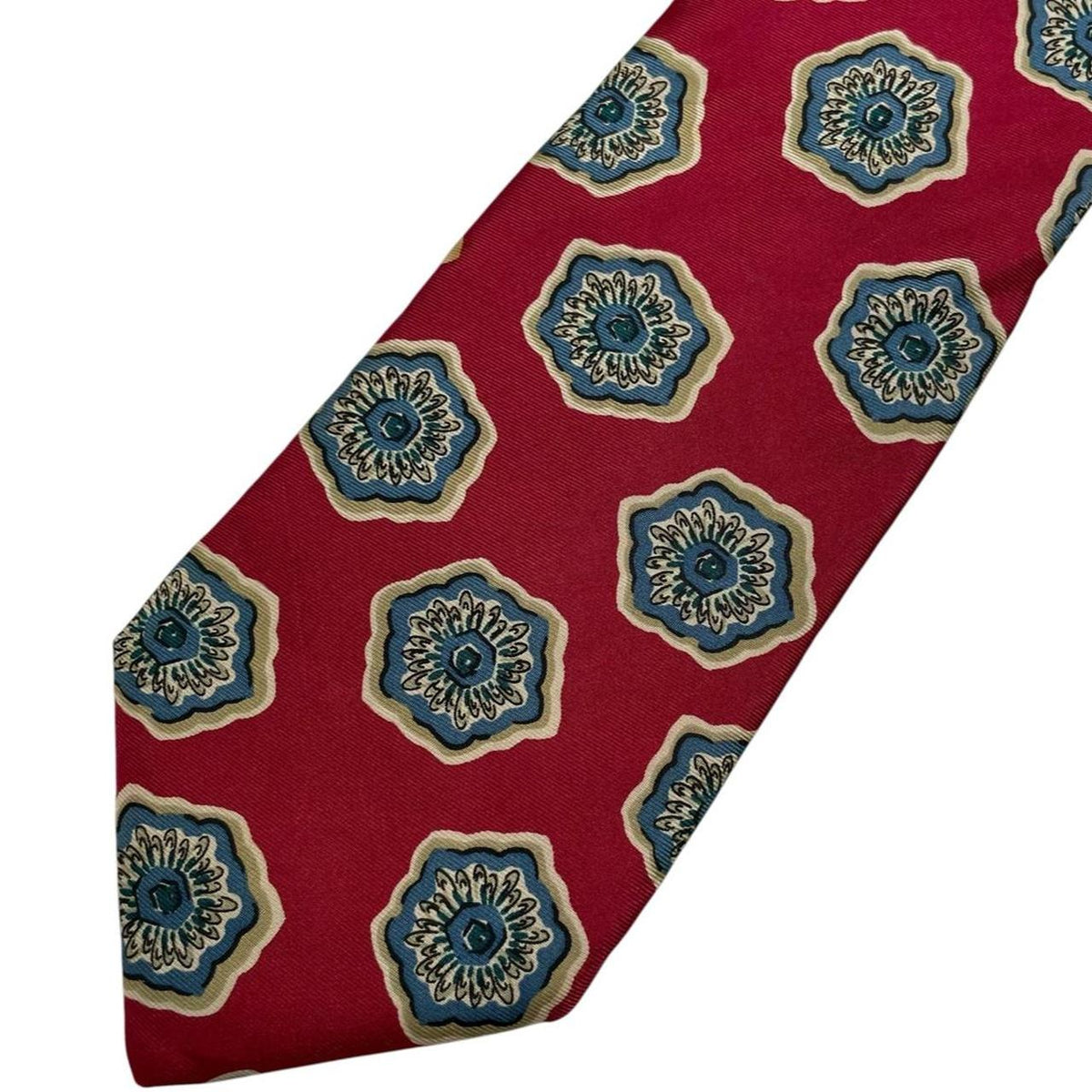 Christian Dior red silk tie with geometric pattern and logo detail.