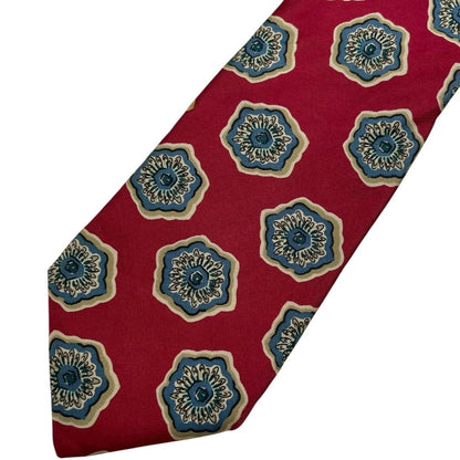 Christian Dior red silk tie with geometric pattern and logo detail.