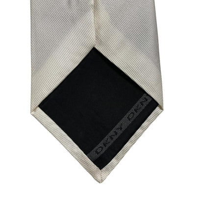 DKNY white silk tie with smooth texture and classic design.