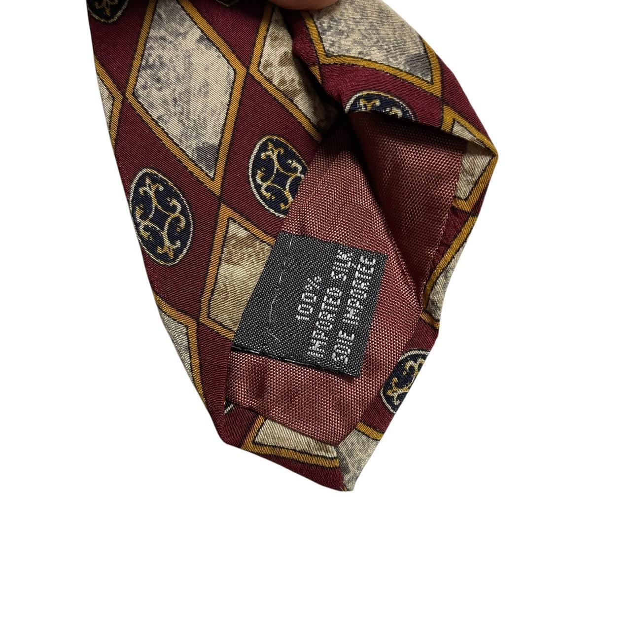 Christian Dior cream silk tie with multicoloured abstract print and logo detail.