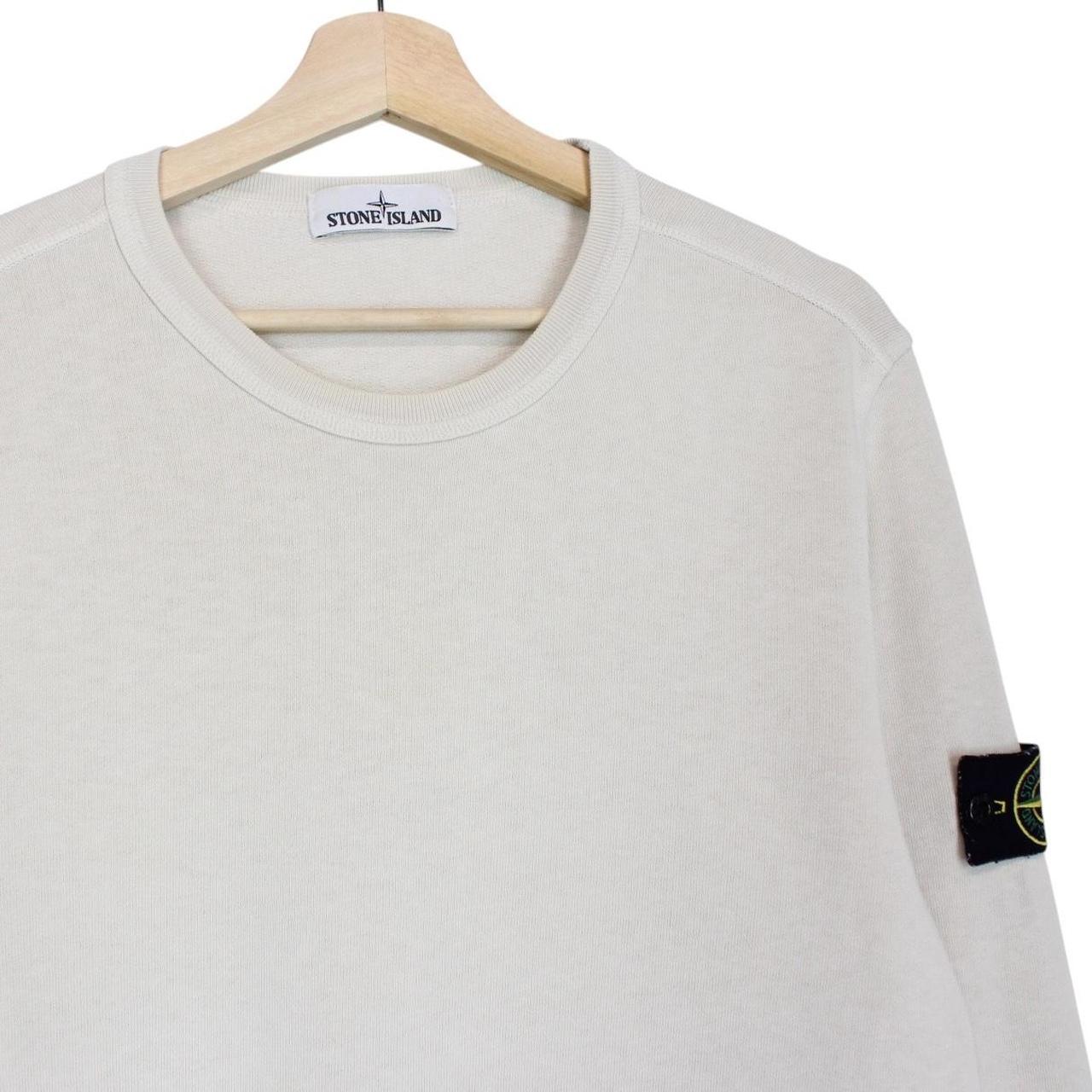 Stone Island beige cotton sweatshirt with logo patch and ribbed cuffs.