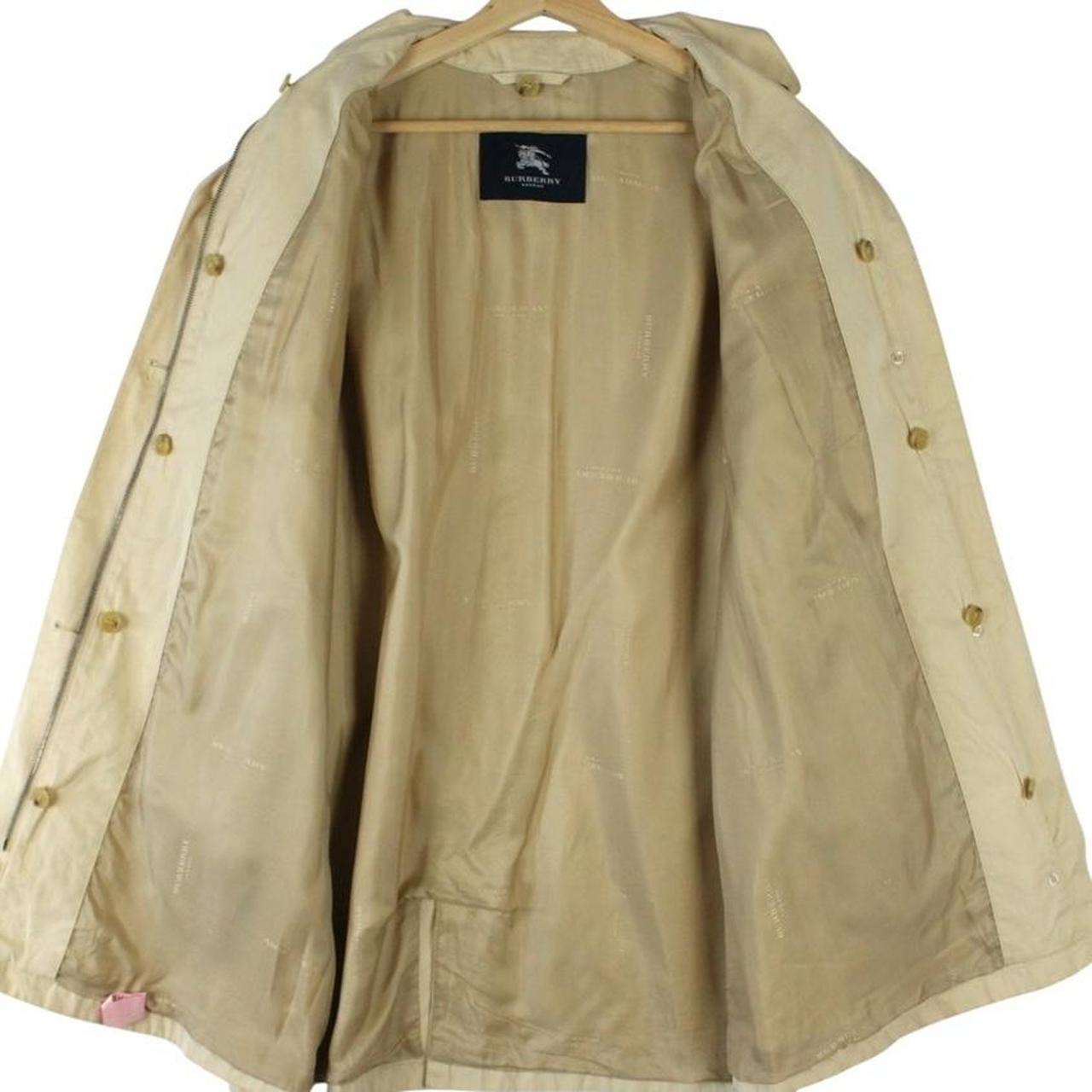 Burberry beige single breasted coat with logo detail and classic tailored design.