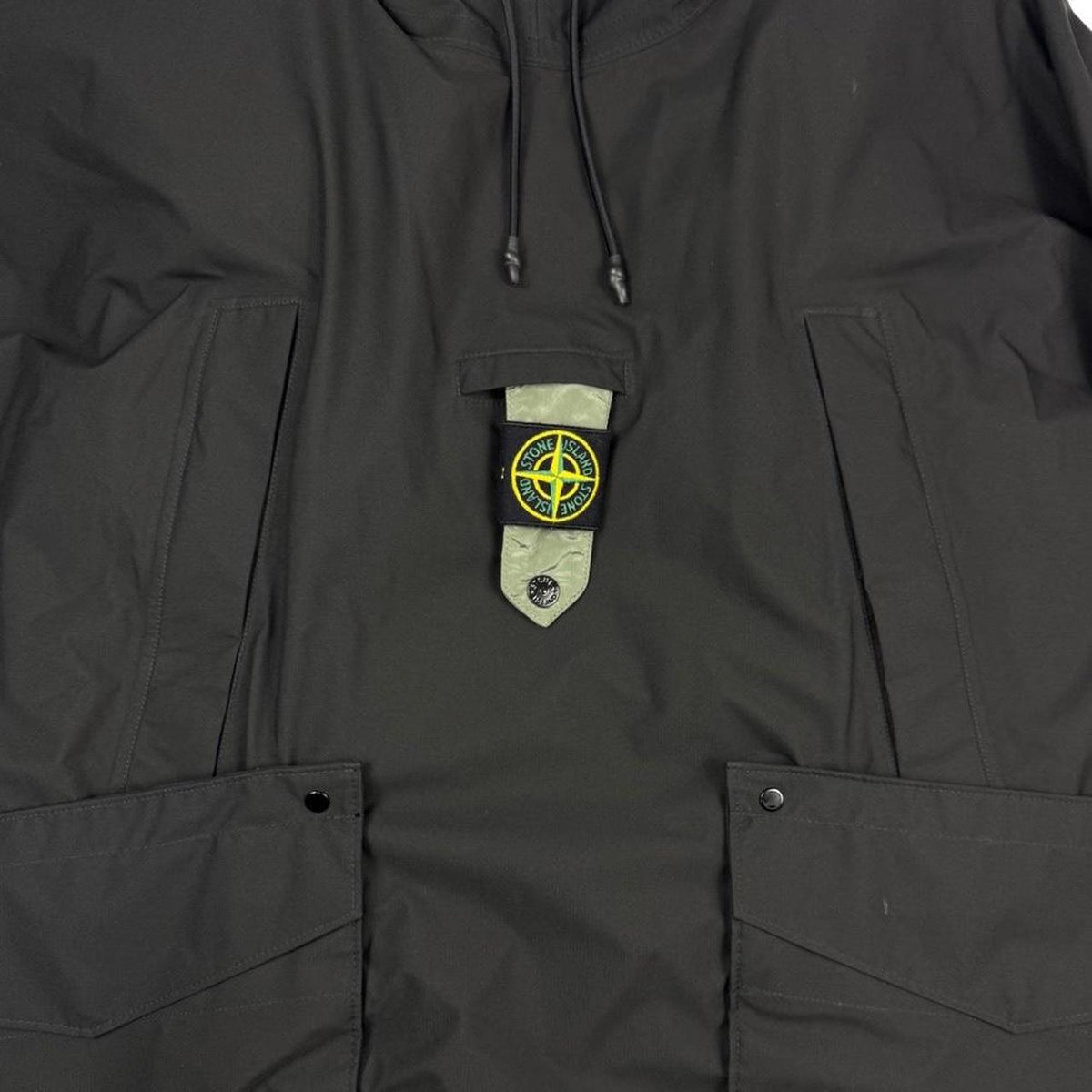 Stone Island black quilted gilet with Gore-Tex logo and ripstop material.