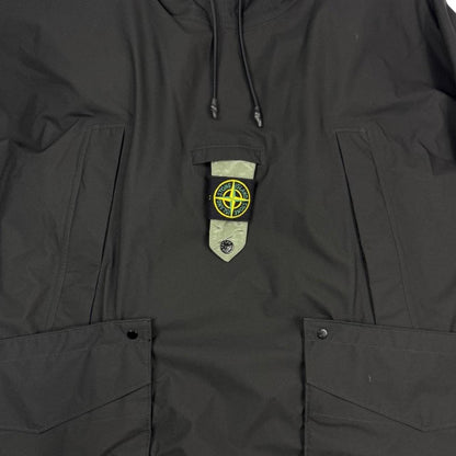 Stone Island black quilted gilet with Gore-Tex logo and ripstop material.