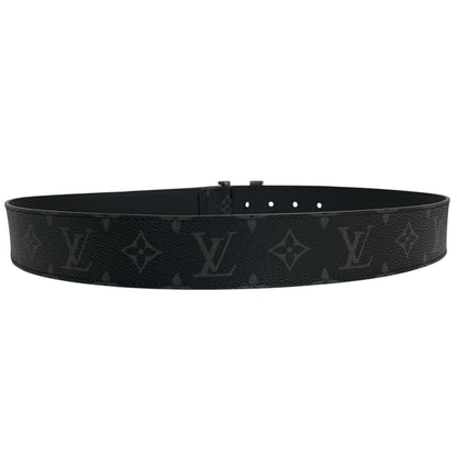 Louis Vuitton black canvas belt with LV monogram pattern and gold-tone buckle.