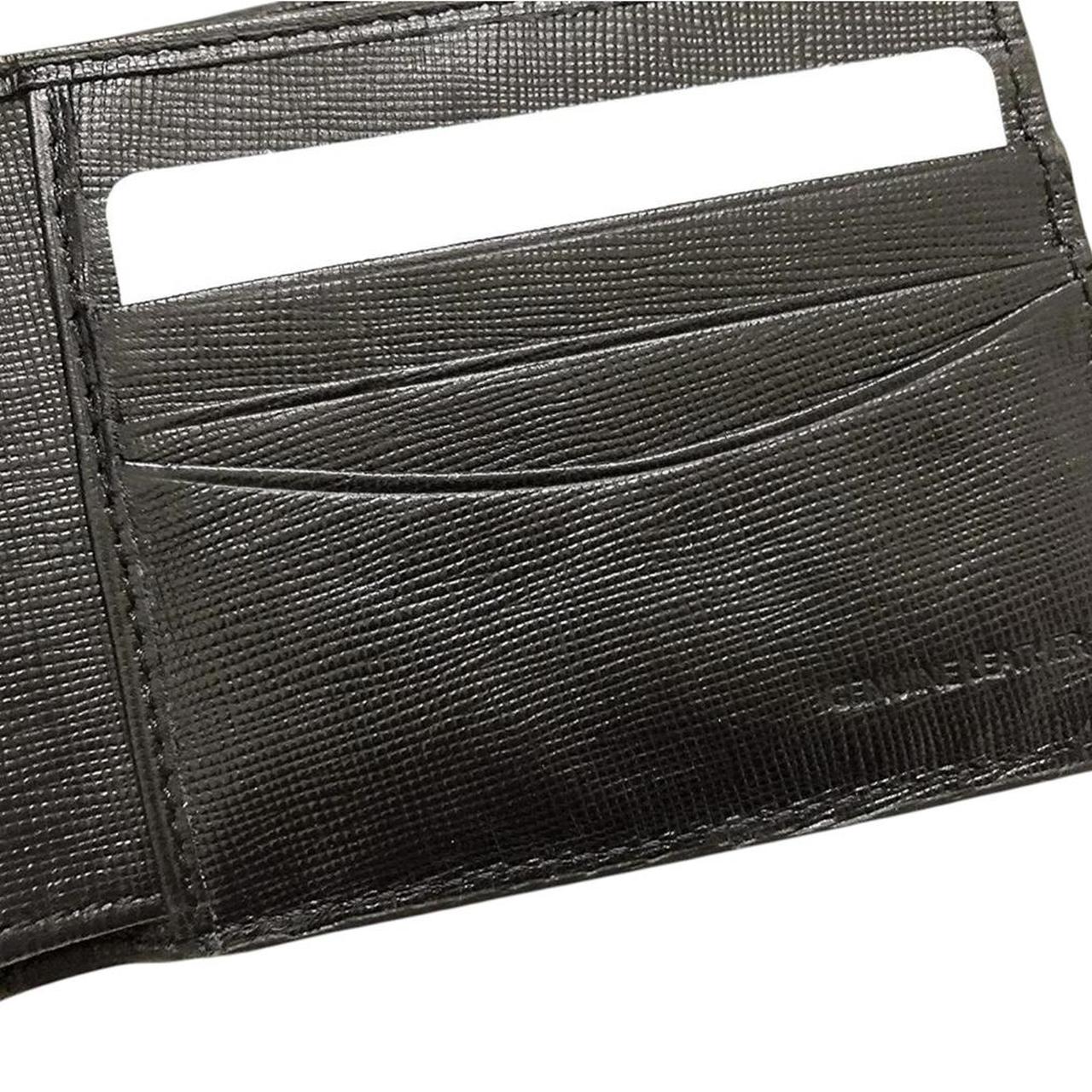Paul Smith black bifold wallet textured crosshatch leather with logo detail.