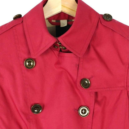 Burberry pink double breasted jacket with Nova Check pattern and logo detail.