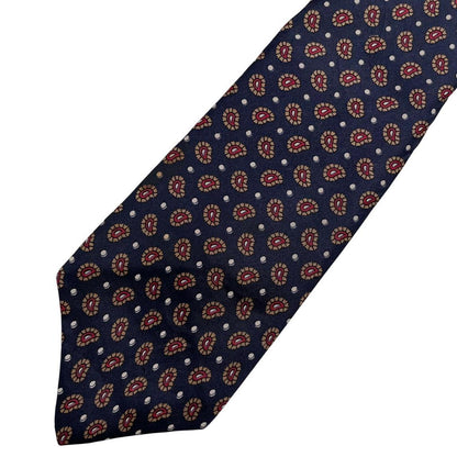 Christian Dior navy blue silk tie with paisley print pattern and logo detail.