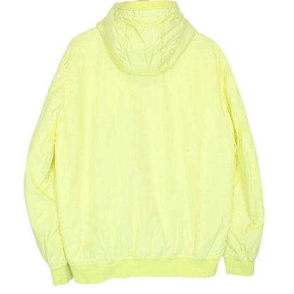 Stone Island yellow jacket with crinkle texture and logo badge on sleeve.