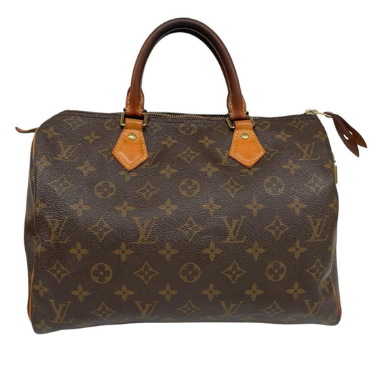 Louis Vuitton beige and brown monogram coated canvas shopping tote with padlock detail.
