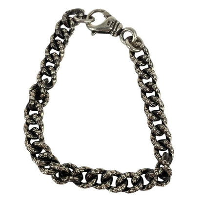 Chrome Hearts silver bracelet with intricate link design and logo detailing.