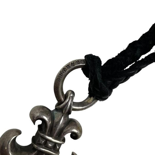 Chrome Hearts silver fleur de lis pendant with leather cord, vintage 1998 design.