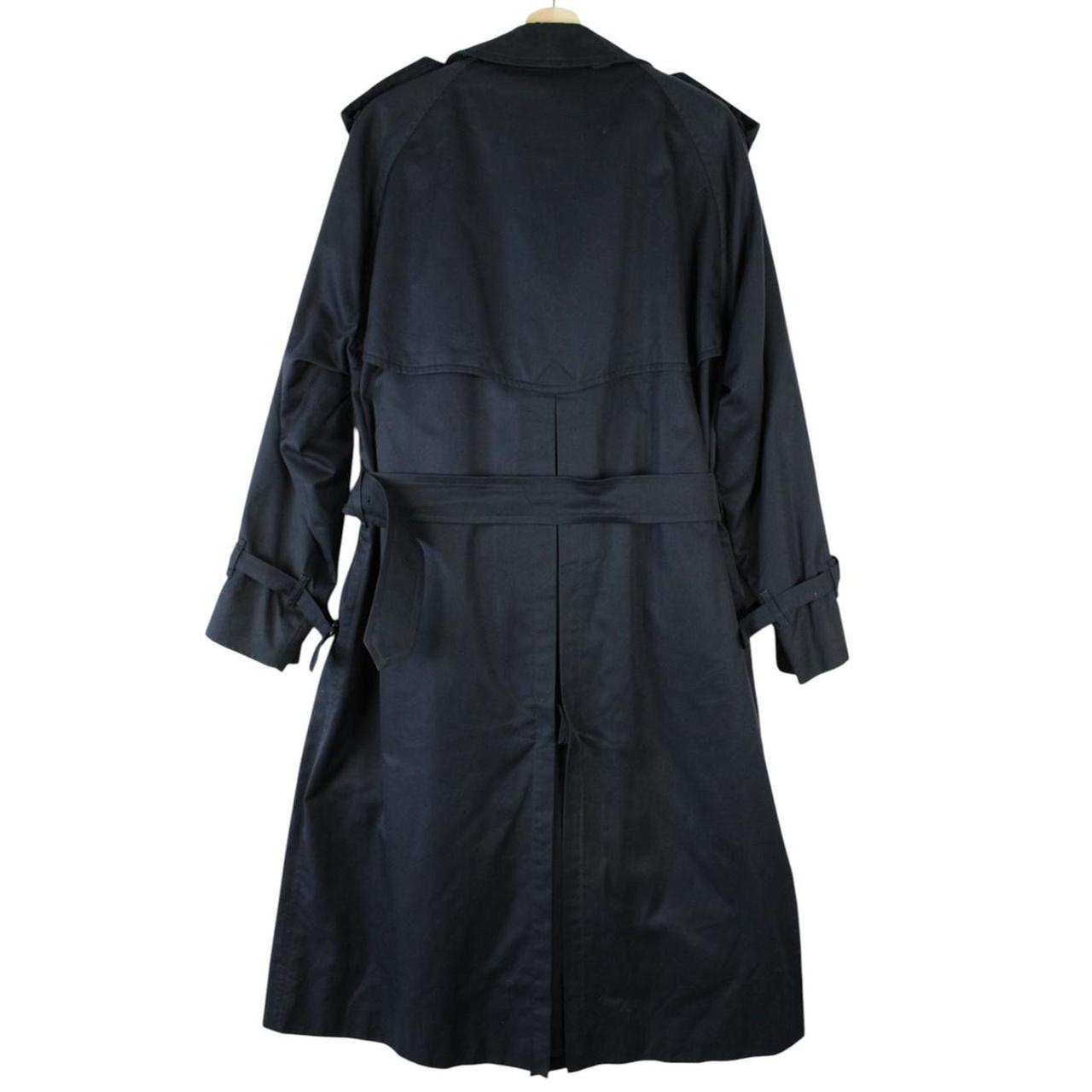 Burberry navy blue belted double breasted trench coat with iconic check lining.
