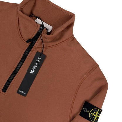 Stone Island orange jumper with 1/4 zip, logo patch on sleeve, organic cotton.