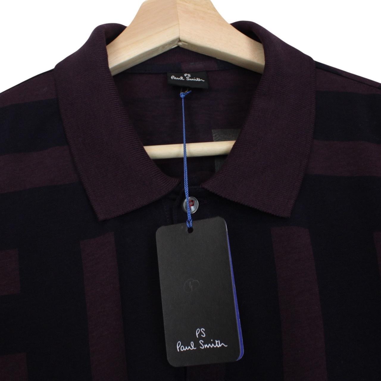 Paul Smith burgundy polo shirt with short sleeves, cotton material, brand logo on collar.