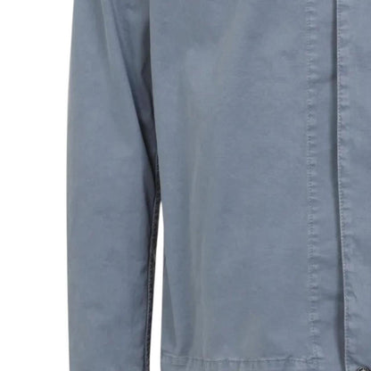 Stone Island blue overshirt jacket with chest pocket, two-way zip, and logo detail.