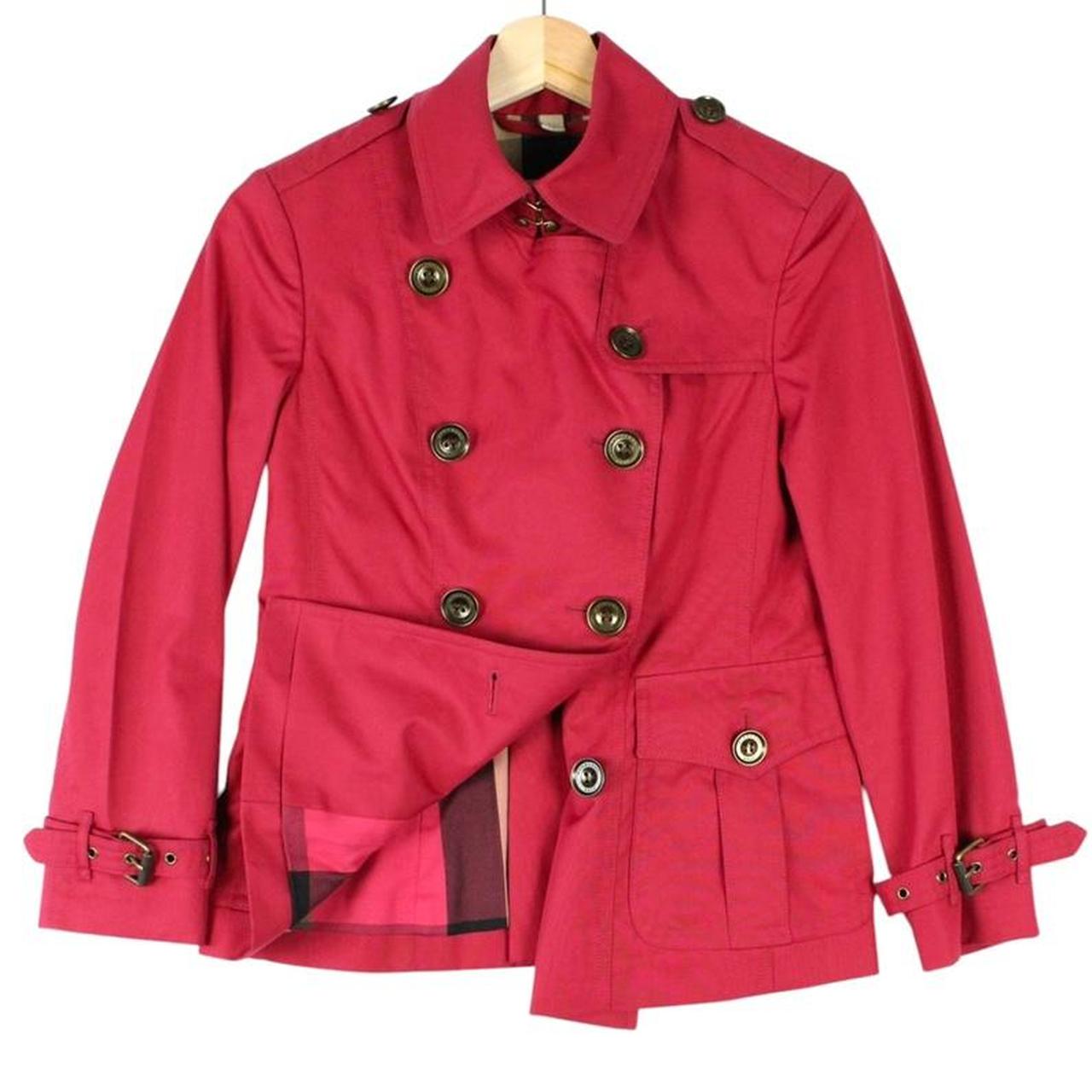 Burberry pink double breasted jacket with Nova Check pattern and logo detail.