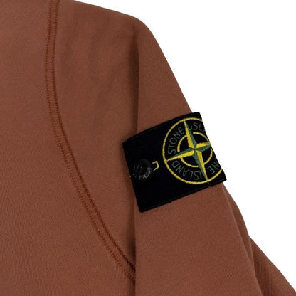 Stone Island orange jumper with 1/4 zip, logo patch on sleeve, organic cotton.