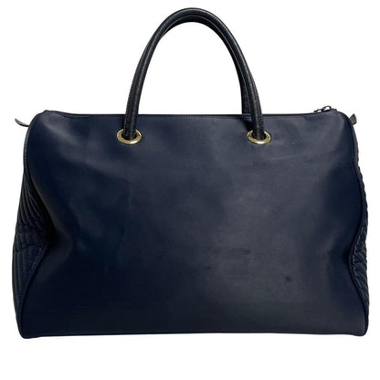 Yves Saint Laurent navy blue duffel bag embossed logo nylon material with handles.