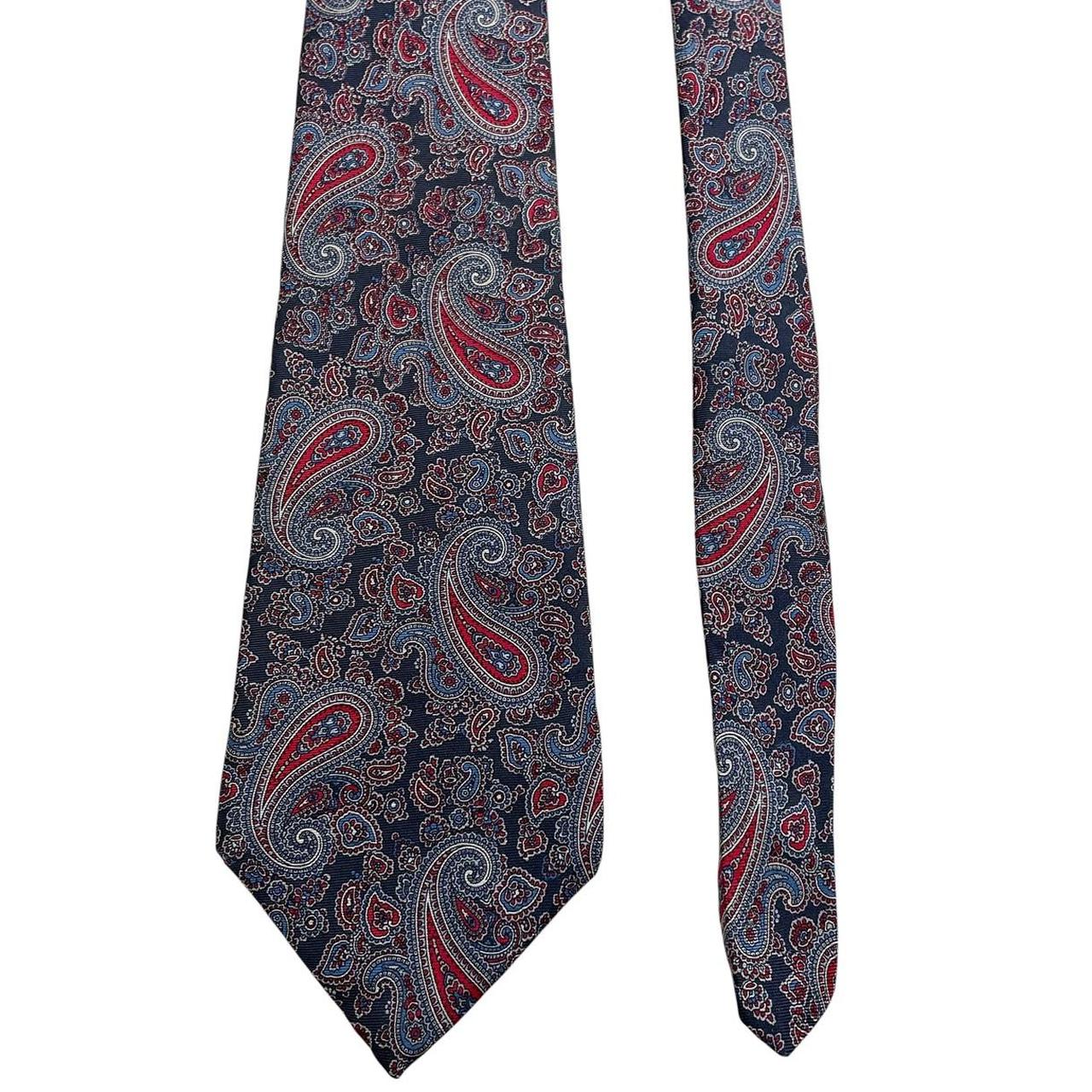 Christian Dior multicoloured paisley silk tie with intricate pattern and smooth texture.