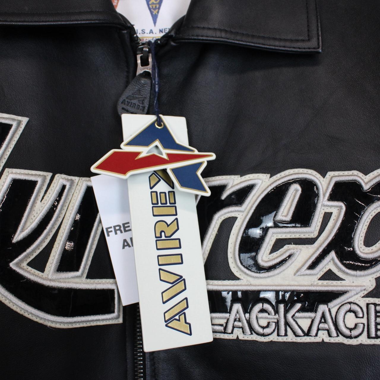 Avirex black leather jacket with Tuskegee Aces logo and full zip design.