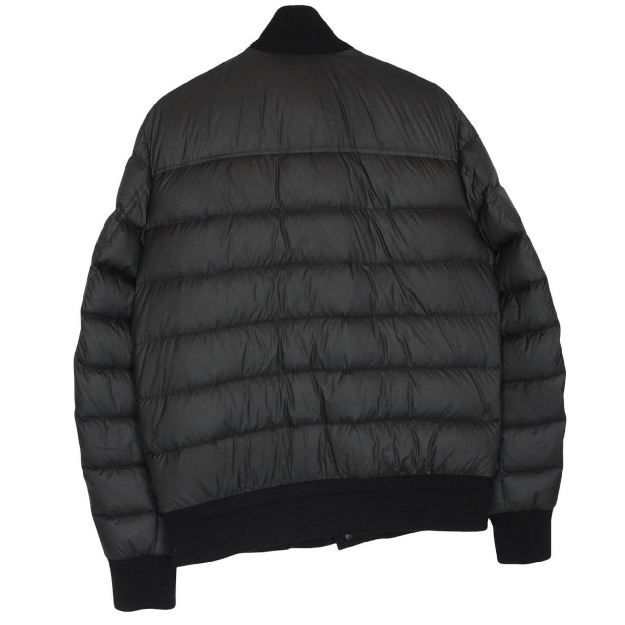 Moncler black suede leather down jacket with full zip and missing badge detail.