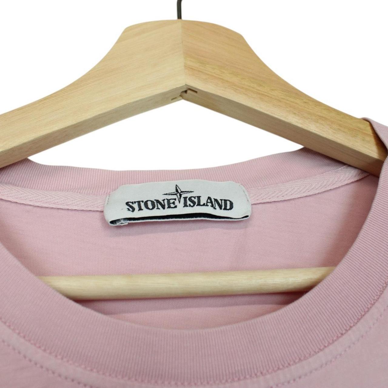 Stone Island pink long sleeve t-shirt with compass logo and pocket detail.