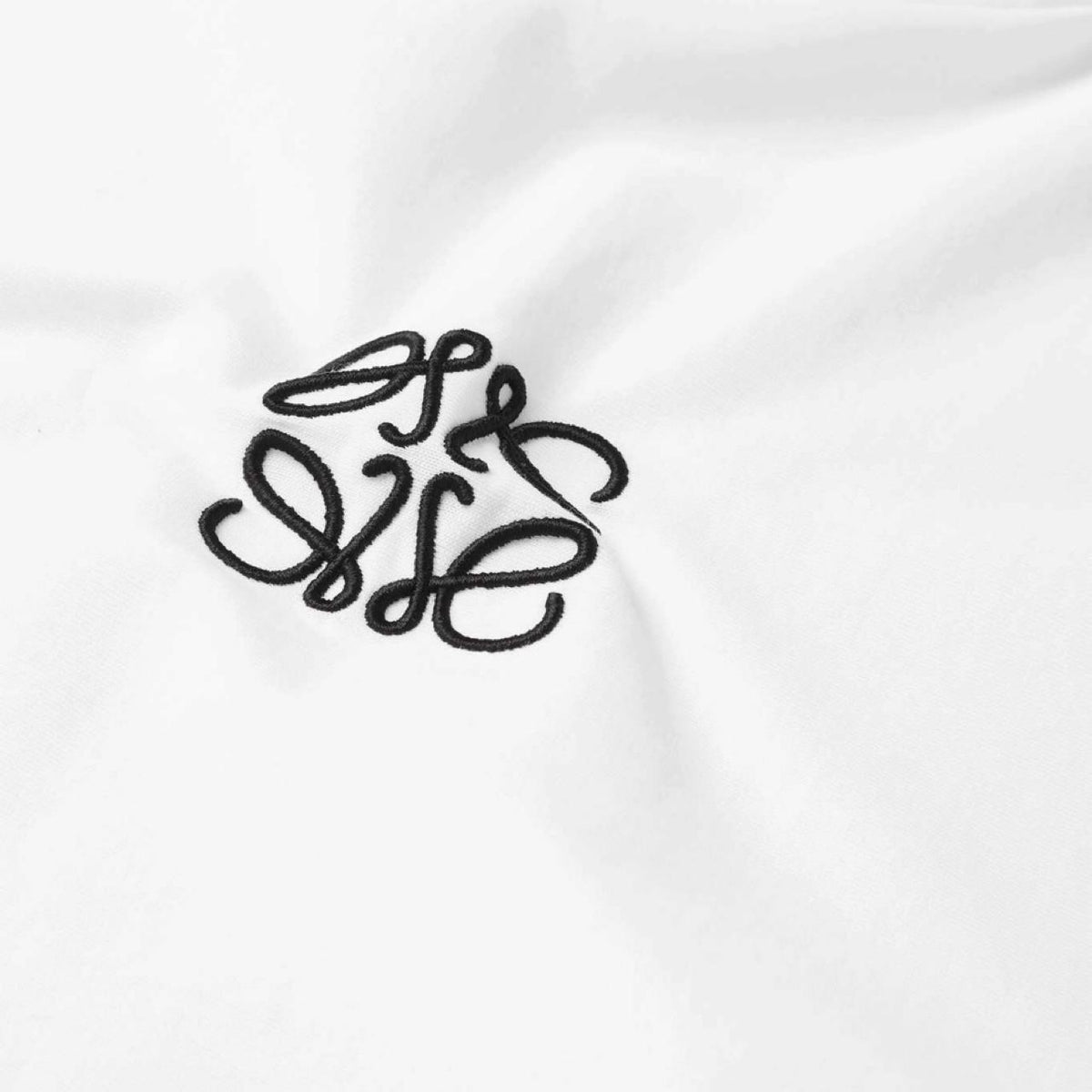 Loewe white short sleeve t-shirt with embroidered anagram logo on chest.