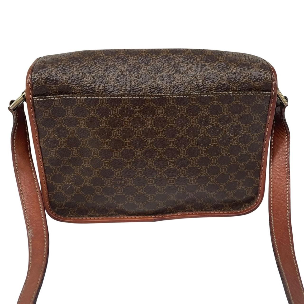 CELINE brown duffel bag with Macadam canvas pattern and logo detail.