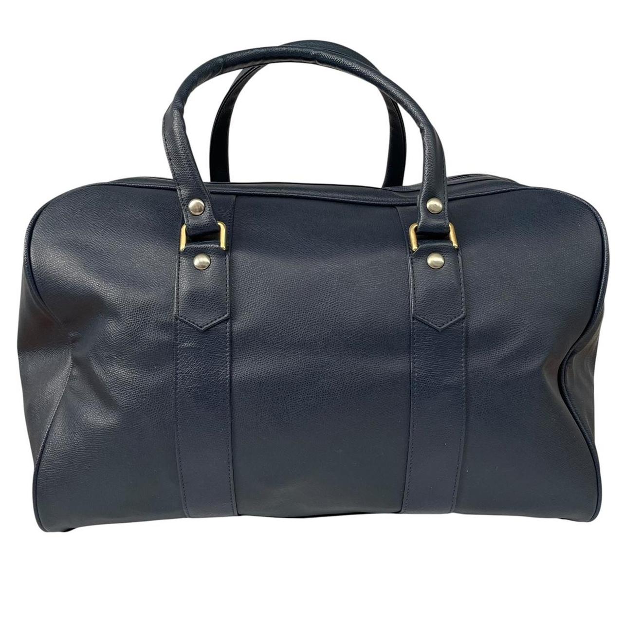 Burberry navy blue duffel bag featuring iconic Nova Check pattern and leather accents.