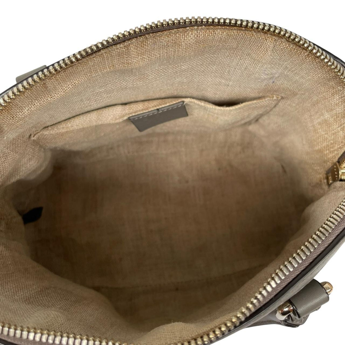 Gucci grey microguccissima mini dome shoulder bag with embossed logo and leather material.