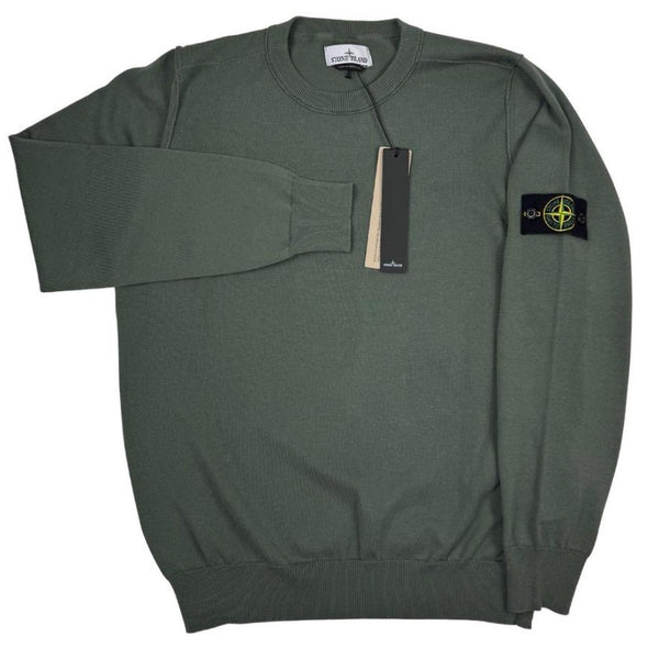Stone Island green knit jumper made from organic cotton with logo patch detail.