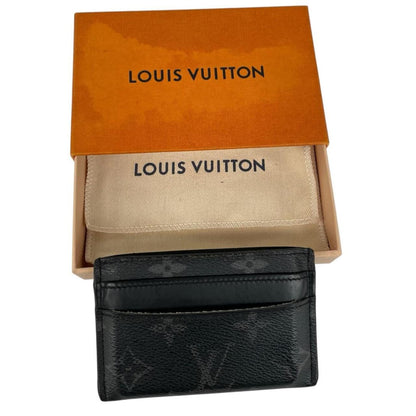 Louis Vuitton black and grey coated canvas double card holder with monogram pattern.