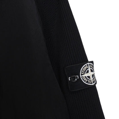 Stone Island black jacket with special process badge and full zip design.