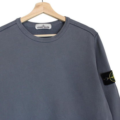 Stone Island blue cotton sweatshirt with iconic compass logo and ribbed cuffs.
