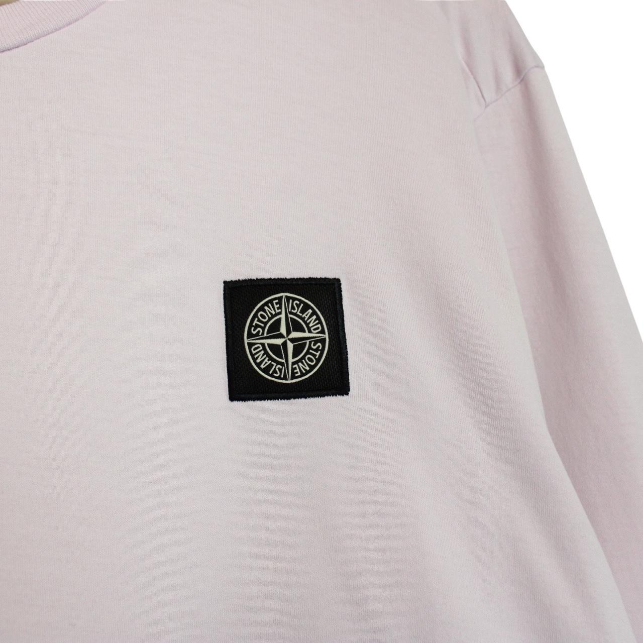 Stone Island pink long sleeve t-shirt with compass logo and pocket detail.