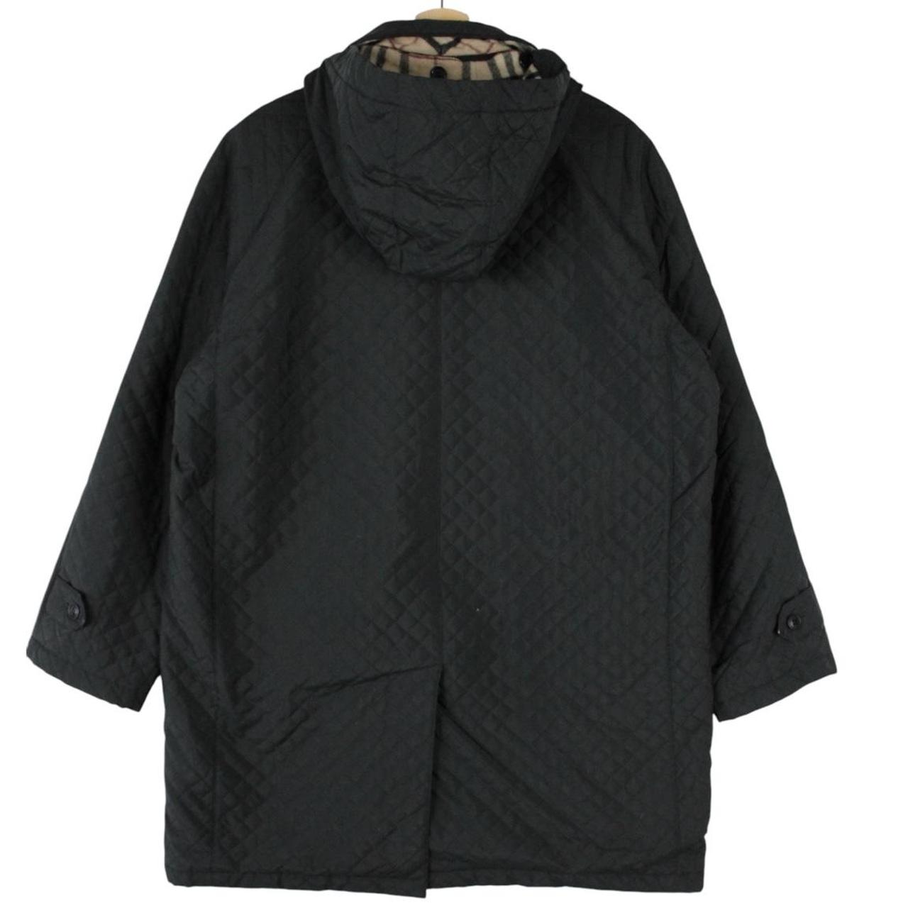 Burberry black quilted jacket with Nova Check lining and logo detail.