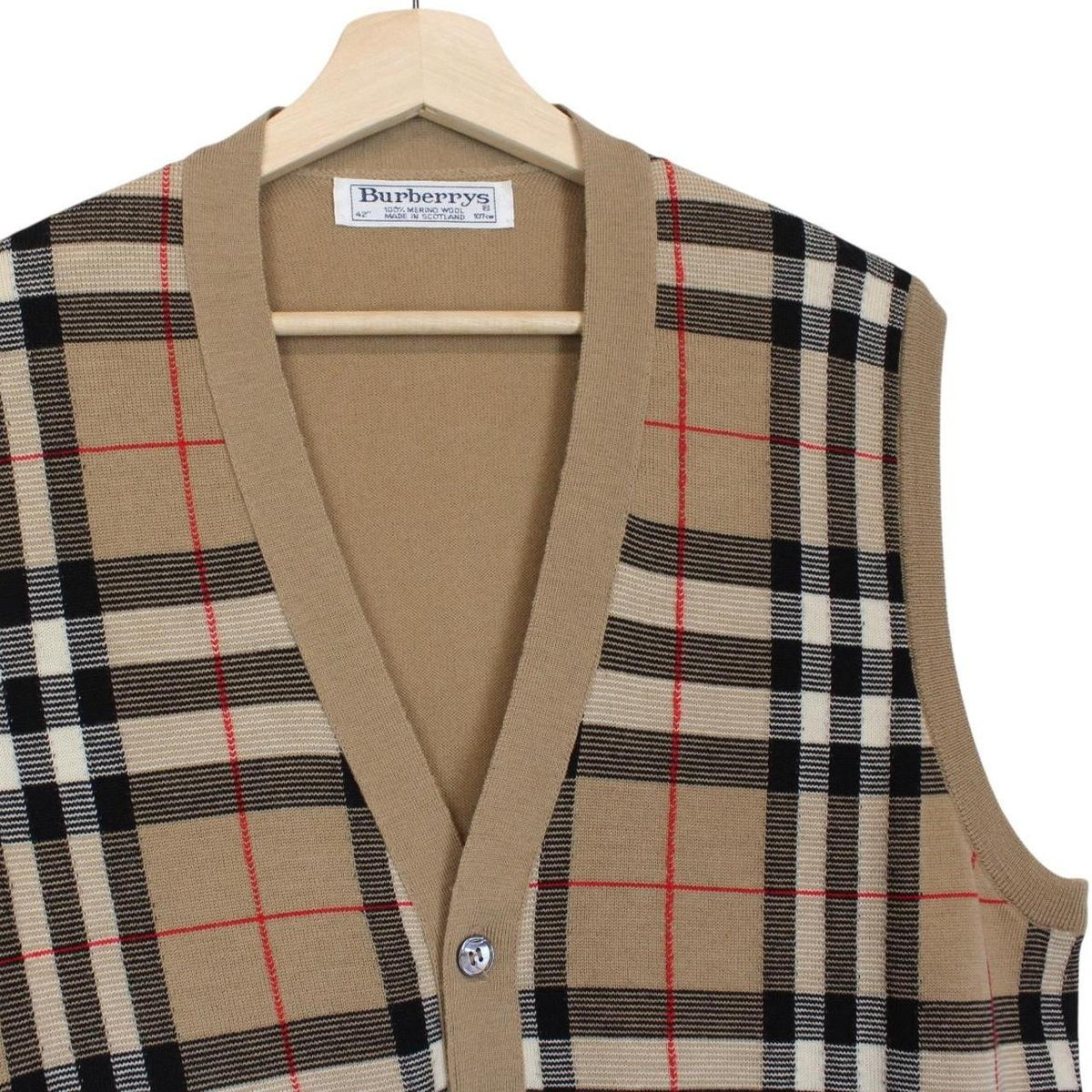 Burberry beige knit sweater vest with Nova Check pattern and merino wool material.