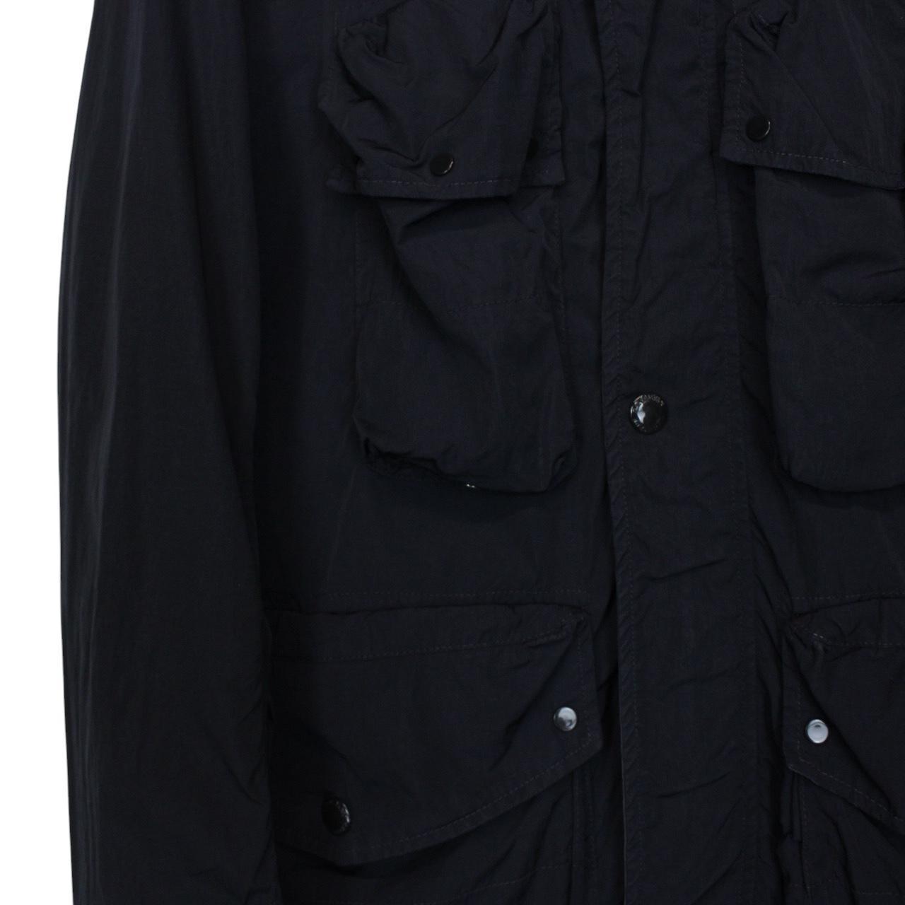 CP Company navy blue nylon jacket with multi pockets and garment dyed finish.