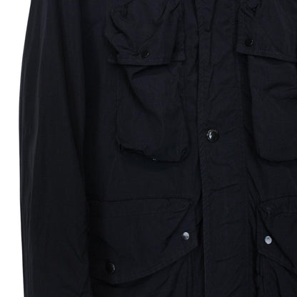 CP Company navy blue nylon jacket with multi pockets and garment dyed finish.