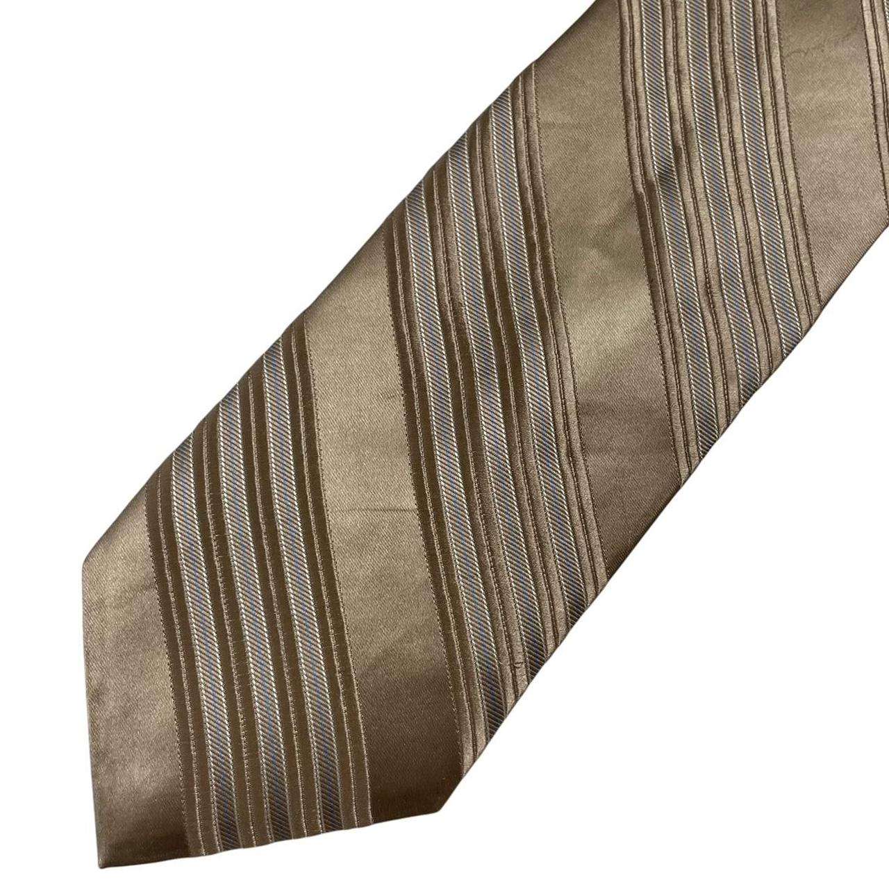 DKNY gold silk tie with vertical stripes and logo detail.