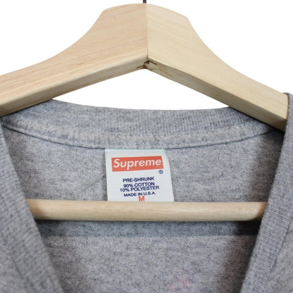 Supreme grey and pink long sleeve cotton t-shirt with wild print and pocket detail.