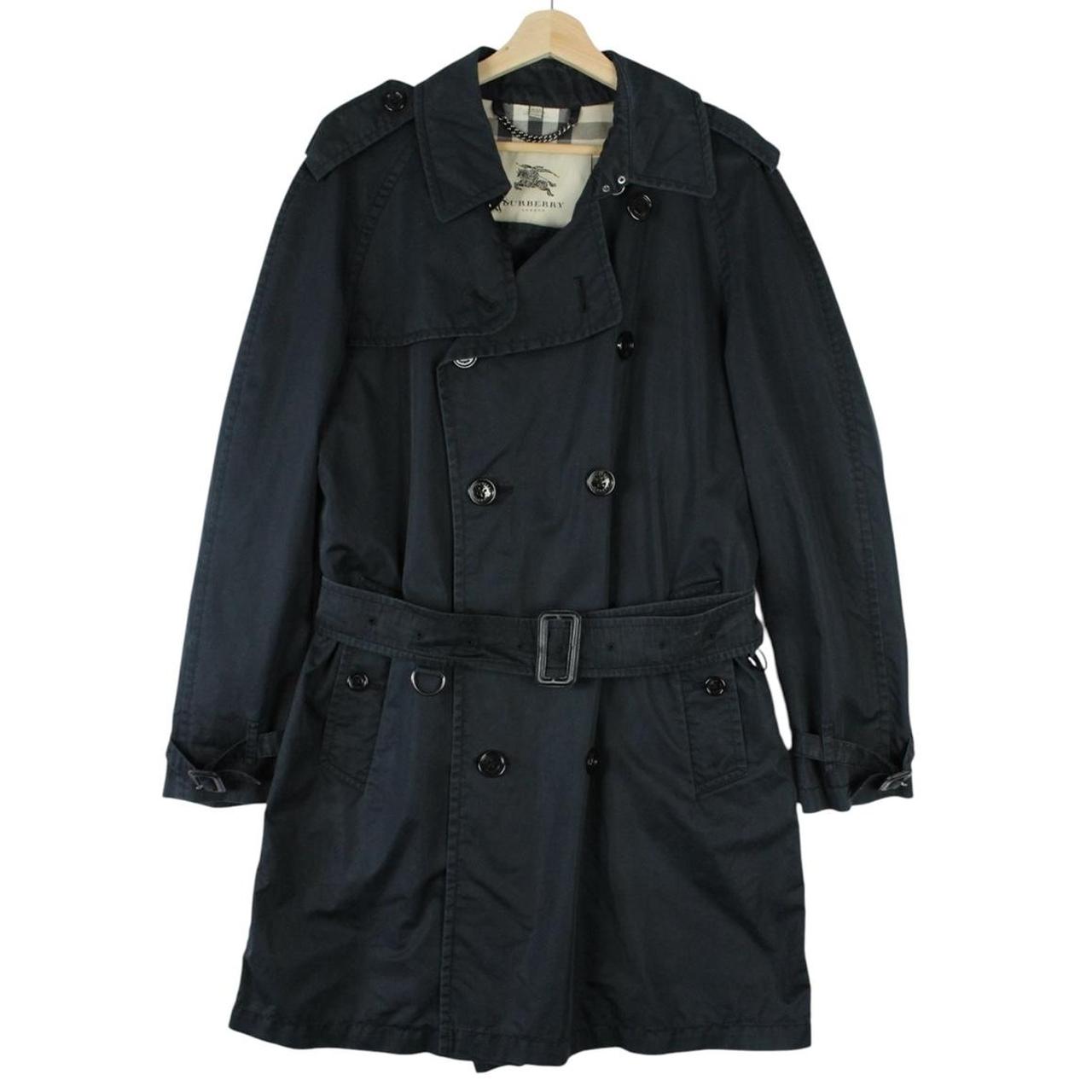 Burberry beige double breasted belted trench coat with classic check lining and logo detail.