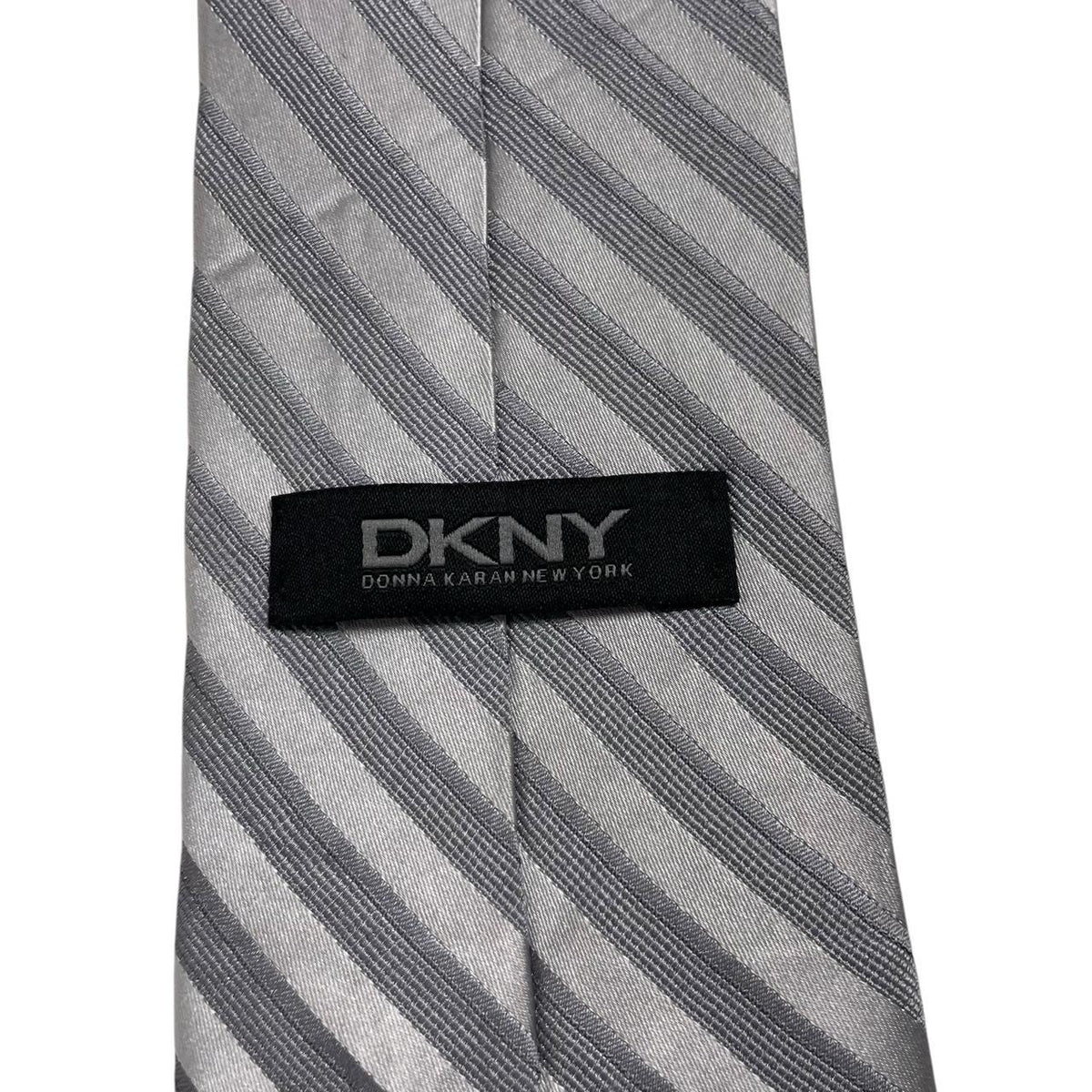 DKNY silver striped silk tie with elegant sheen and vintage design.