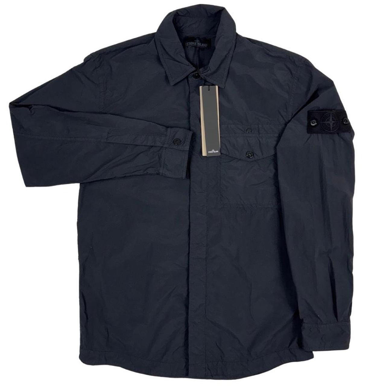 Stone Island black nylon overshirt jacket with ghost logo and smooth texture.