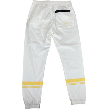 Stone Island white and yellow trousers with logo patch and RE-T fit design.