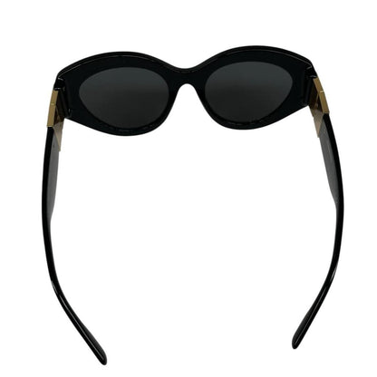 Burberry cat eye sunglasses black and gold with logo detail and case.