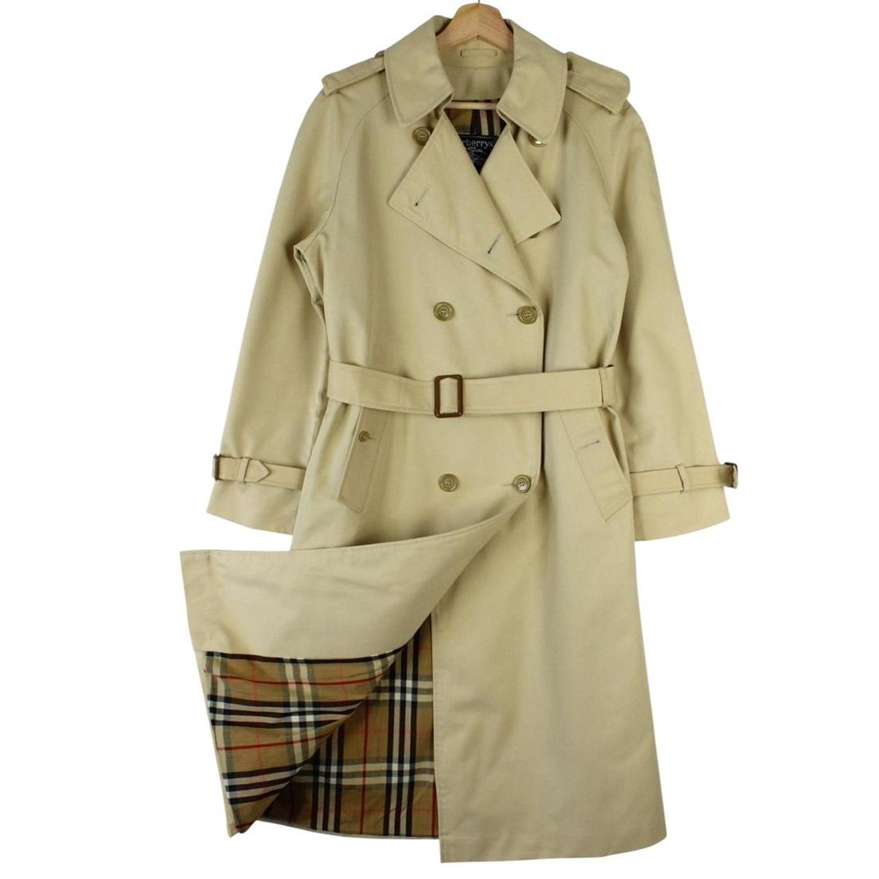Burberry beige trench coat with Nova Check pattern, double-breasted and belted design.